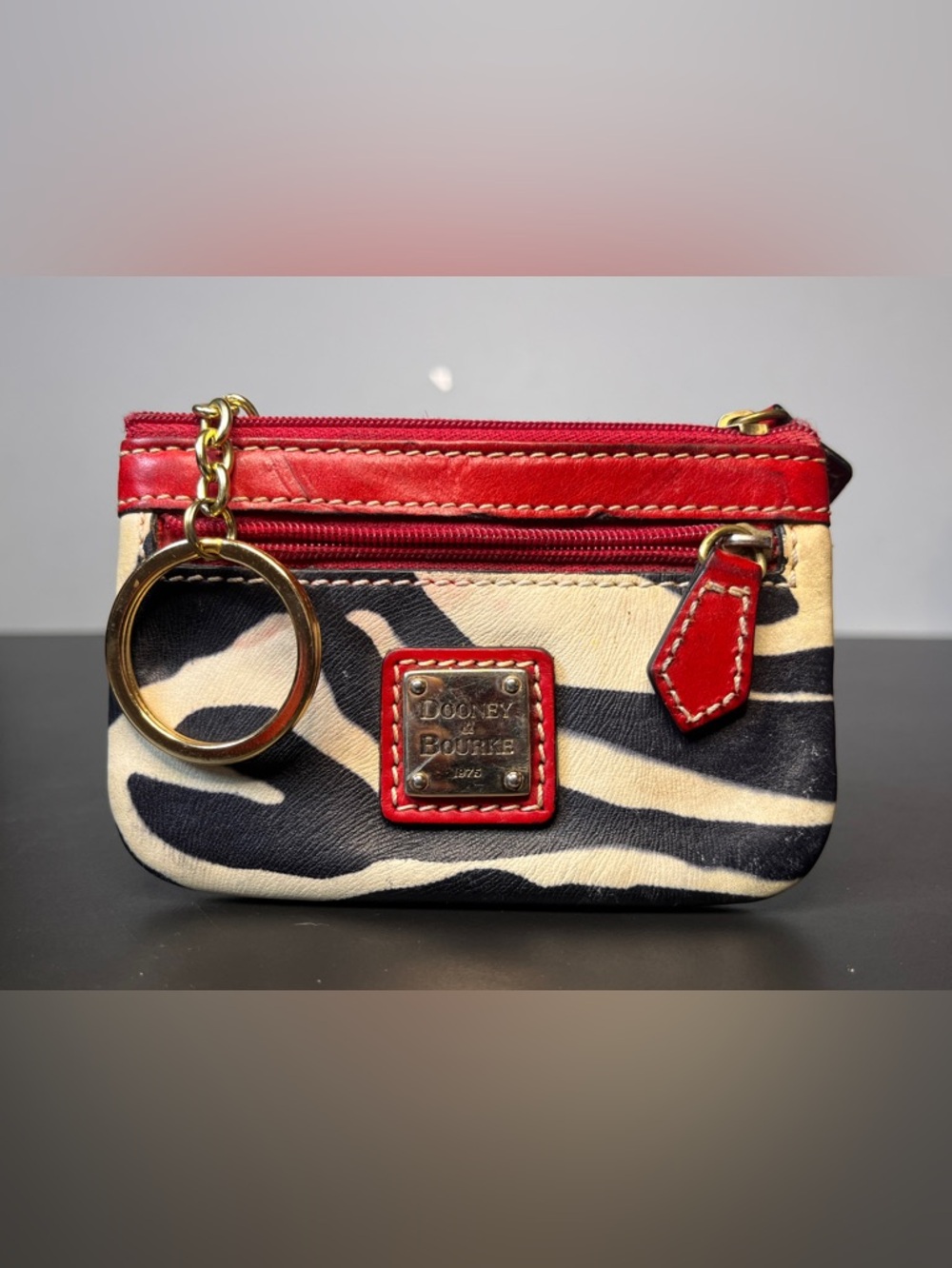 Dooney & Bourke Black and Cream Zebra Coon Purse with Red Trim